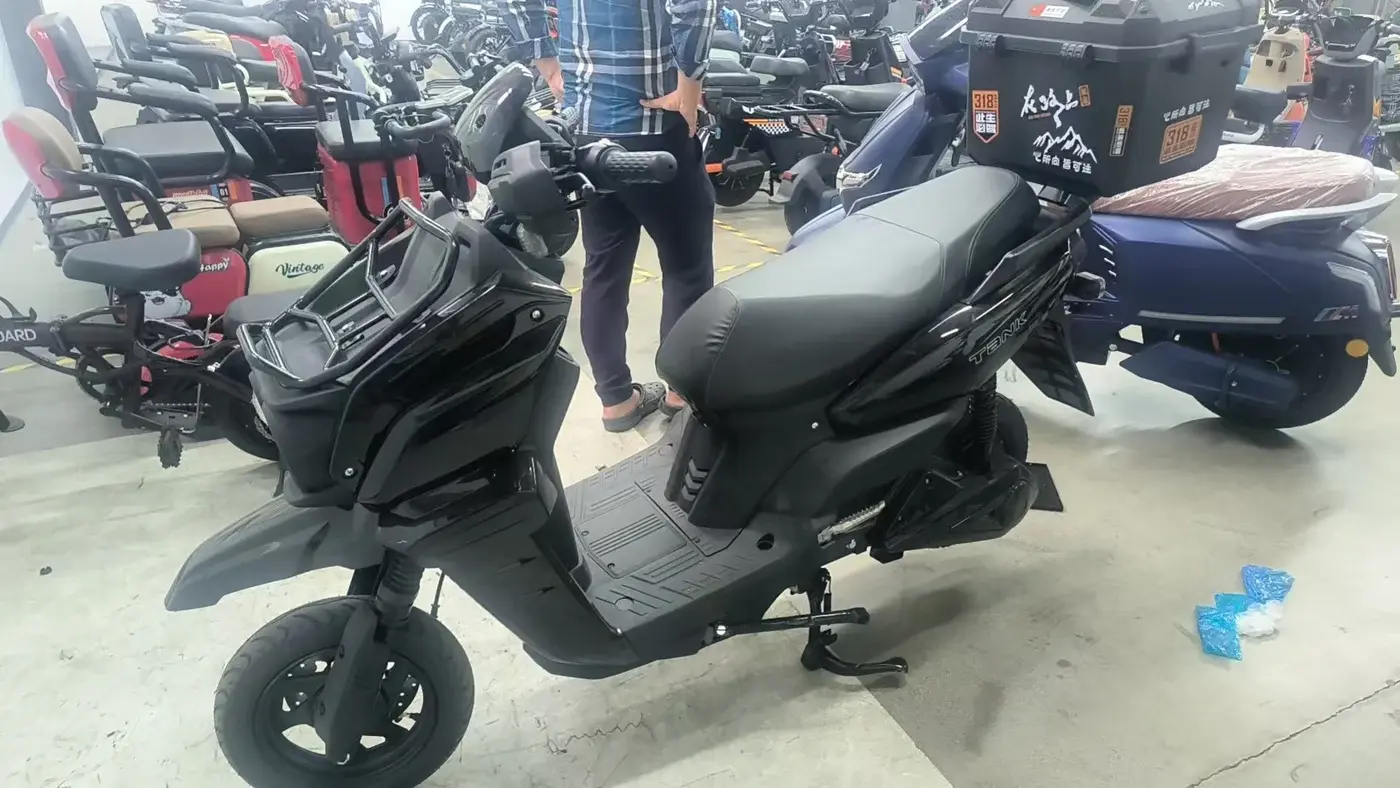 Black 1500W seated electric scooter with rear storage box